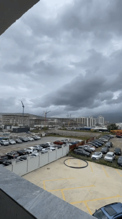 Overcast morning over a Tbilisi construction site and parking lot