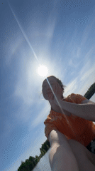 Woman takes paddleboard selfie on Russian lake at dawn