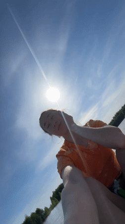 Woman takes paddleboard selfie on Russian lake at dawn