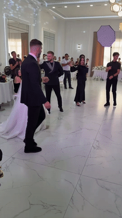 Wedding reception dancing in a bright hall, Mălăiești