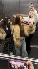 Young women take selfies in Buenos Aires elevator