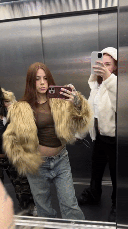 Young women take selfies in Buenos Aires elevator