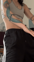 Person with tattoos filmed dancing and resting in Sofia apartment