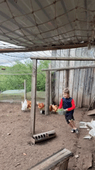 Children tend chickens and garden in rural Russia