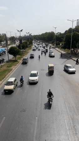 Busy urban traffic on a Karachi multi-lane road