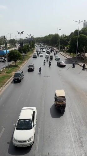 Busy urban traffic on a Karachi multi-lane road