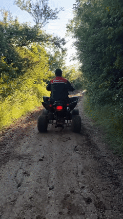 ATV adventure through woods, fields, and muddy terrain