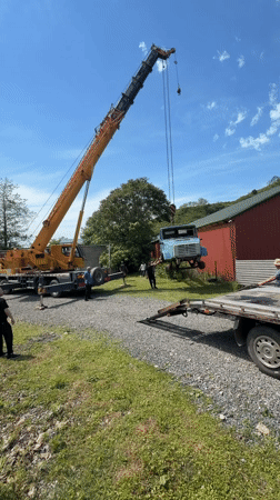 Crane lifts truck cab in Kapreshumi yard operation