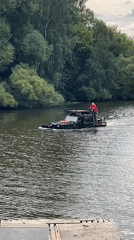 Amphibious vehicle and yacht share an urban waterway