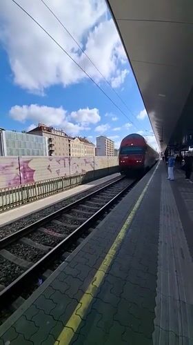 Morning commuter train arrives at Vienna station platform