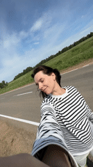 Woman takes roadside selfie in Альняш, Russia