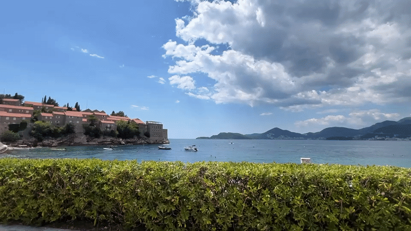 Tourists enjoy typical beach day at Sveti Stefan resort
