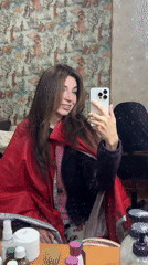 Woman takes selfies, relaxes indoors in Kryvyi Rih Sunday afternoon