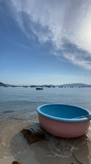 Coracles and fishing boats along Nha Trang's sunny coastline