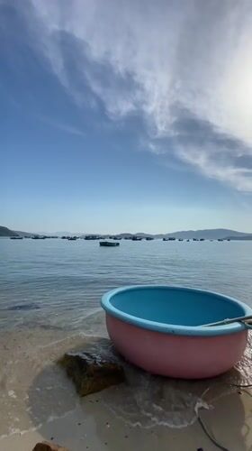 Coracles and fishing boats along Nha Trang's sunny coastline