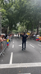 Crowds gather behind barriers on Barcelona street near Gothic building