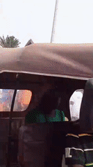 Crowd with speaker walks through Tamale street