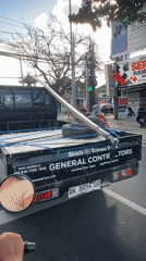 Morning traffic flow on a busy Denpasar street
