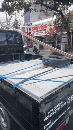 Morning traffic flow on a busy Denpasar street