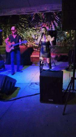 Woman enjoys nighttime social gathering in Armação dos Búzios