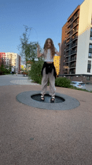 Child plays in Pervomaysky neighborhood amid spring blooms