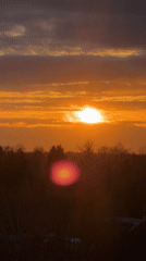 Dramatic sunset captured over forest landscape April 30