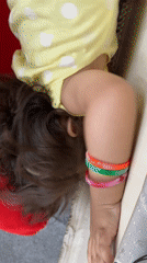 Young girl photographed in quiet indoor moment, Kandahar