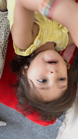 Young girl photographed in quiet indoor moment, Kandahar