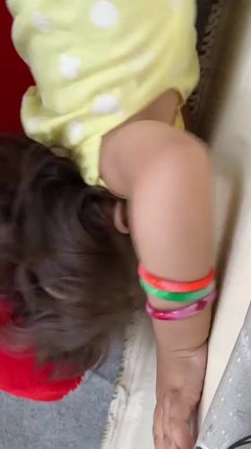 Young girl photographed in quiet indoor moment, Kandahar