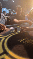 Poker night at a Krasnoyarsk club, chips stacked and cards in play