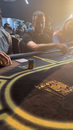 Poker night at a Krasnoyarsk club, chips stacked and cards in play