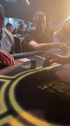 Poker night at a Krasnoyarsk club, chips stacked and cards in play