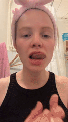 Woman performs morning skincare routine in Saint Petersburg bathroom