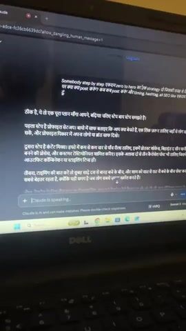 The video shows a laptop screen displaying a webpage with text in both English and Hindi. The English text asks for a "step by step zero to hero strategy" for posting content, including tips on timing, hashtags, and SEO. The Hindi text appears to be a response to this query, offering advice in three steps: profile setup, content creation, and timing/hashtags. A text box at the bottom indicates "Claude is speaking," suggesting the content is generated by an AI. The laptop itself has a visible Dell logo on the keyboard area. The lighting suggests the video was recorded in a dimly lit environment, possibly indoors.