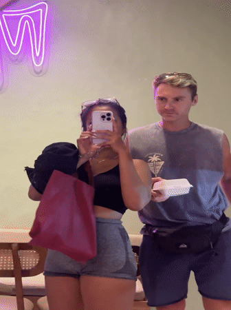 Tourists photograph themselves at Batubulan dessert shop location