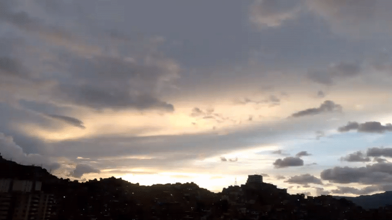 Caracas at dusk: hillside neighborhoods and a city settling into night