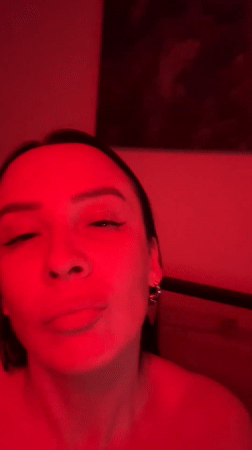 Woman filmed in red lighting in Chaikovsky, Russia