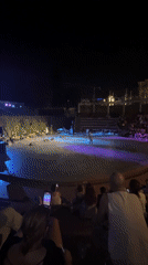 Live outdoor concert under purple lights in Thessaloniki
