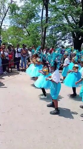Young dancers perform in turquoise costumes at Abuja park