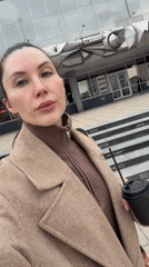 Woman enjoys coffee outdoors in Perm, Russia