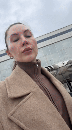 Woman enjoys coffee outdoors in Perm, Russia