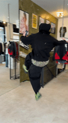 Person films martial arts moves, takes selfies in London store