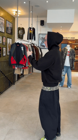 Person films martial arts moves, takes selfies in London store