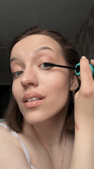 Woman completes morning beauty routine in Reshetnikovo, Russia