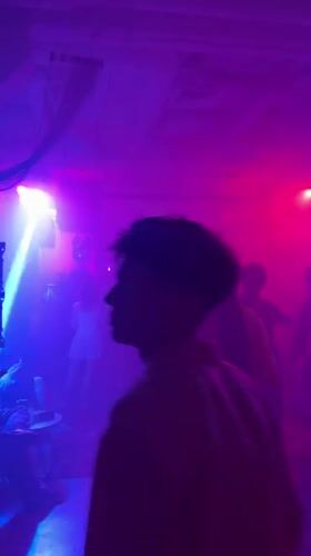 Nightclub scene captured in Tashkent with dancers and lighting
