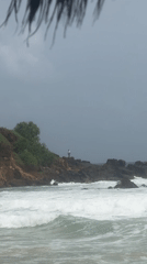 Lone figure spotted on rocky Sri Lankan coast during choppy seas