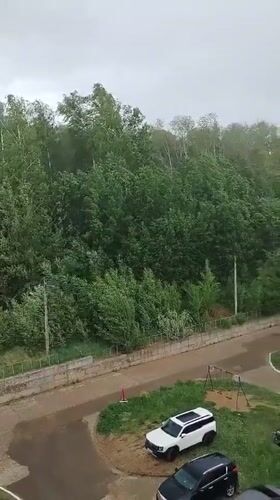 Woman documents stormy day indoors in Noviy, Russia