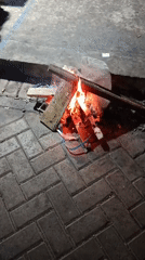 Small fire burns at a busy night market in Malang