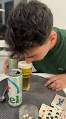 Man enjoys beer at table in Rijeka, Croatia