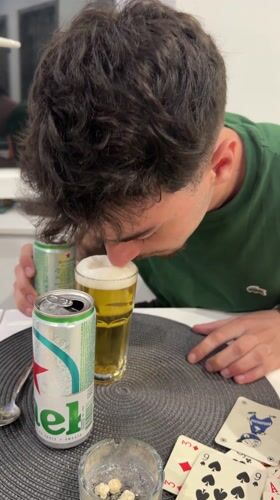 Man enjoys beer at table in Rijeka, Croatia